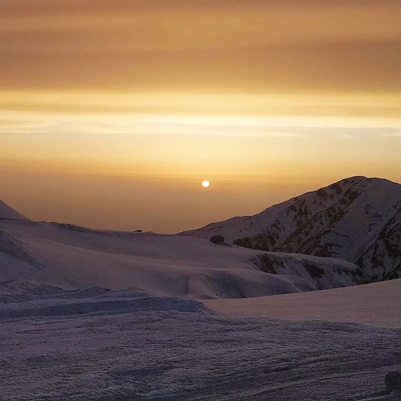 雪景色と夕日